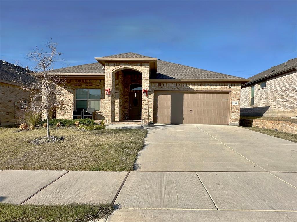 149 Attwater Road Rhome, TX 76078 - Photo 17 of 28 a view of a house with a garage