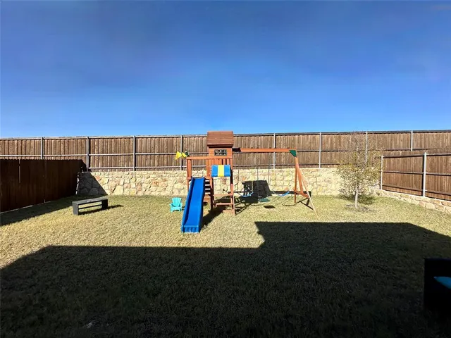 a view of a swimming pool with an outdoor space and seating area