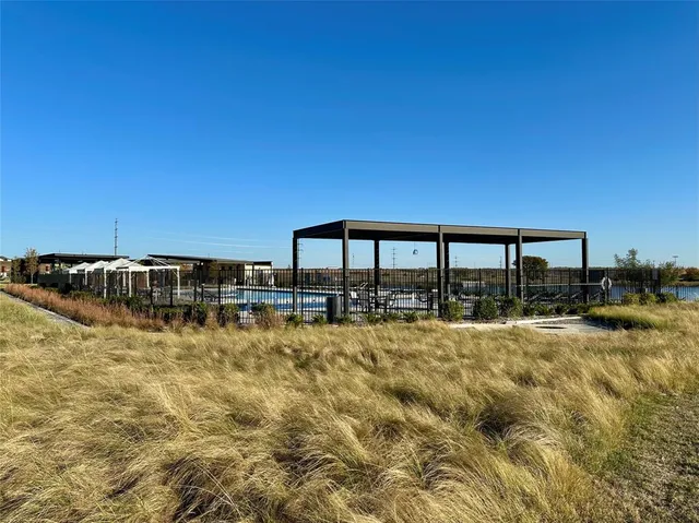a view of a swimming pool with an outdoor seating