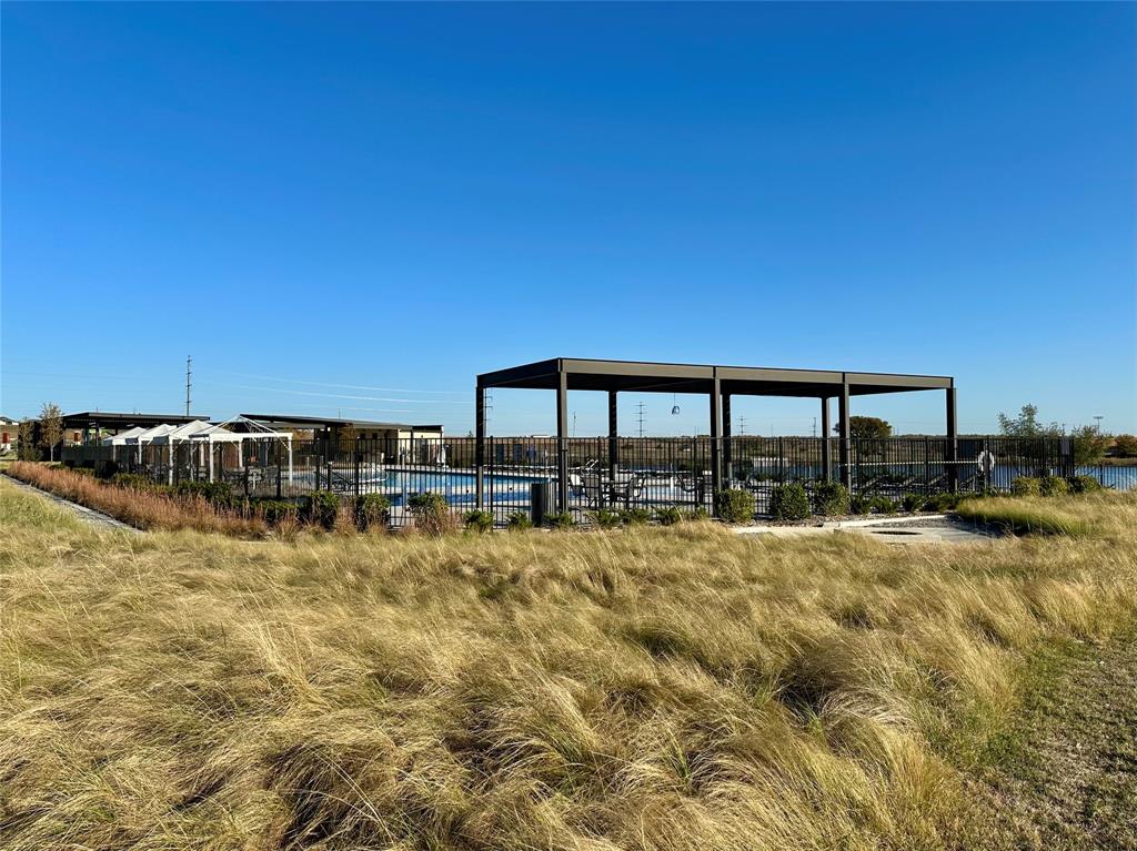 149 Attwater Road Rhome, TX 76078 - Photo 25 of 28 a view of a swimming pool with an outdoor seating