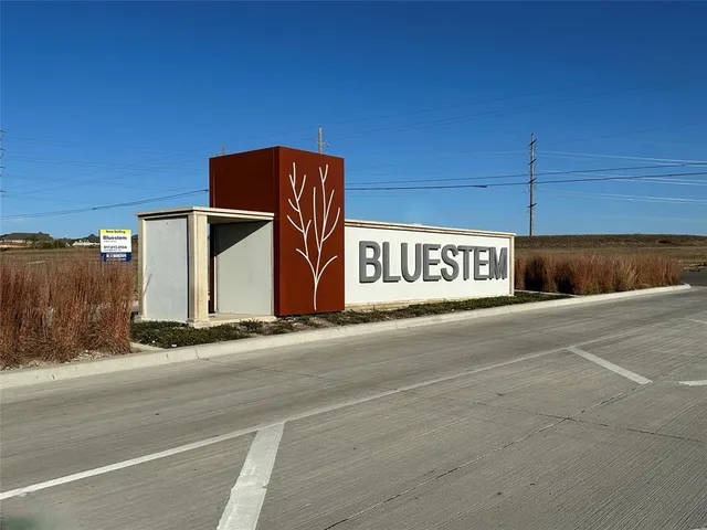a sign board on the side of a building