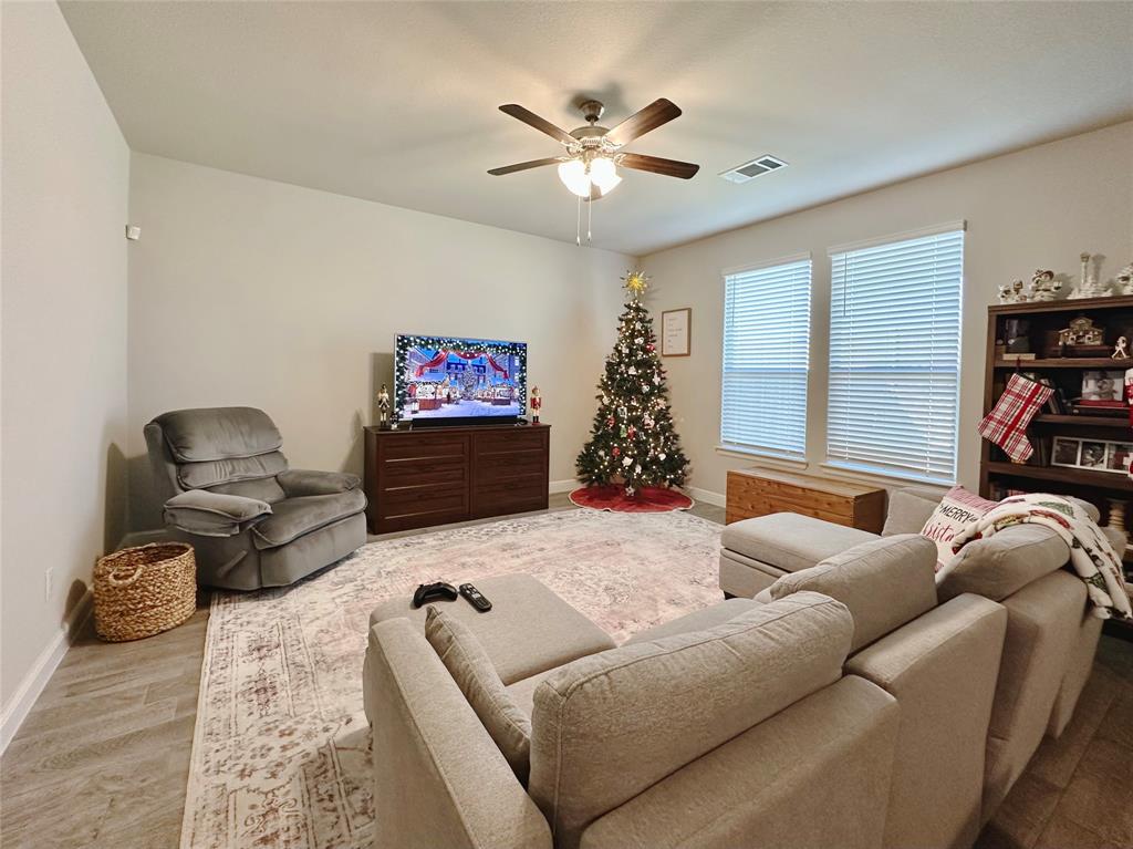 149 Attwater Road Rhome, TX 76078 - Photo 3 of 28 a living room with furniture and a large window