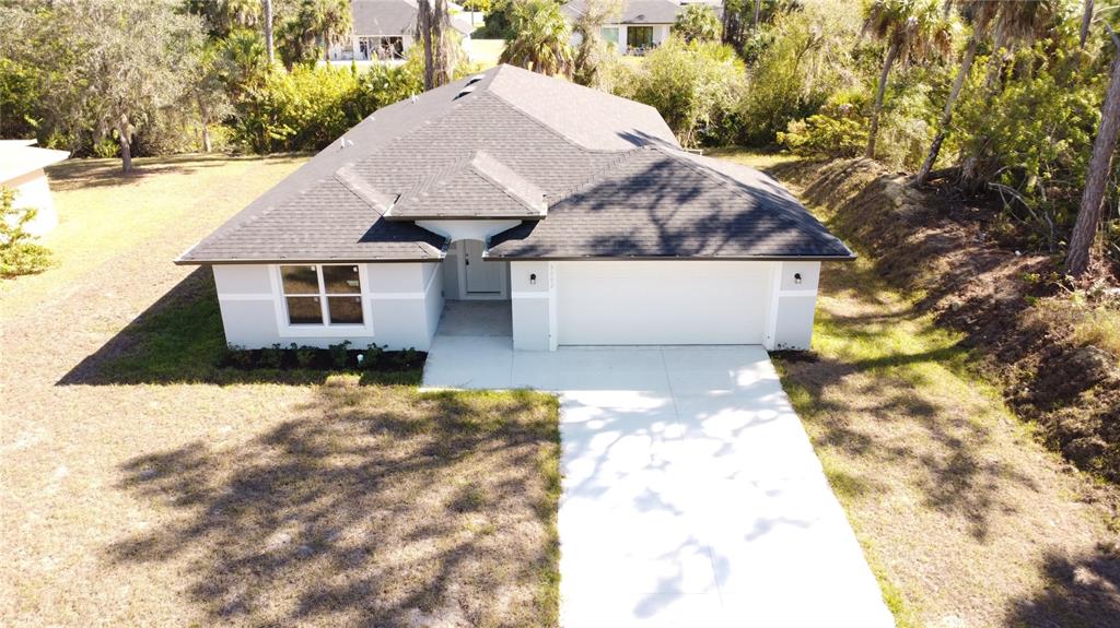 3082 Parade Terrace North Port, FL 34286 - Photo 18 of 18 a view of a house with a yard