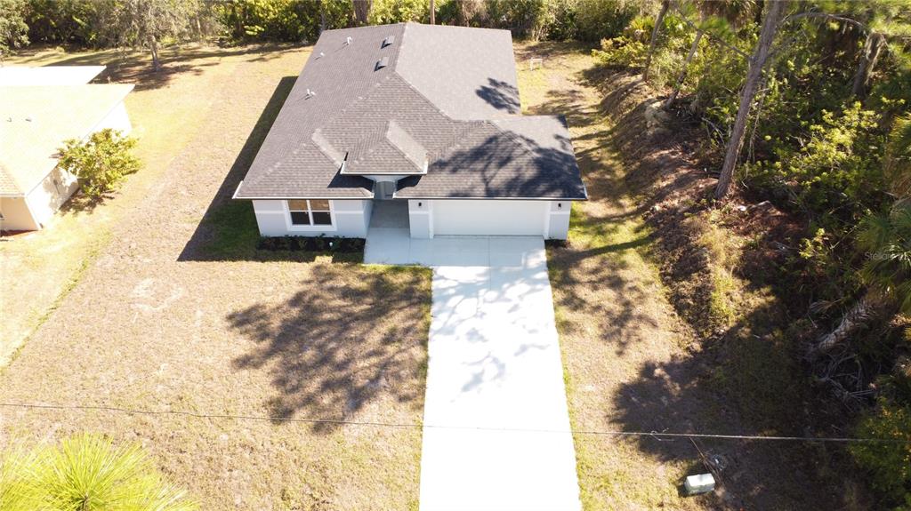 3082 Parade Terrace North Port, FL 34286 - Photo 2 of 18 a view of house with yard