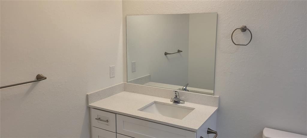 3082 Parade Terrace North Port, FL 34286 - Photo 6 of 18 a bathroom with a sink and a mirror