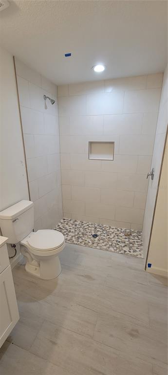 3082 Parade Terrace North Port, FL 34286 - Photo 7 of 18 a white toilet sitting next to a bathroom sink