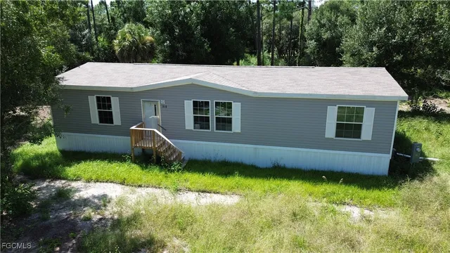 a backyard of a house with lots of green space