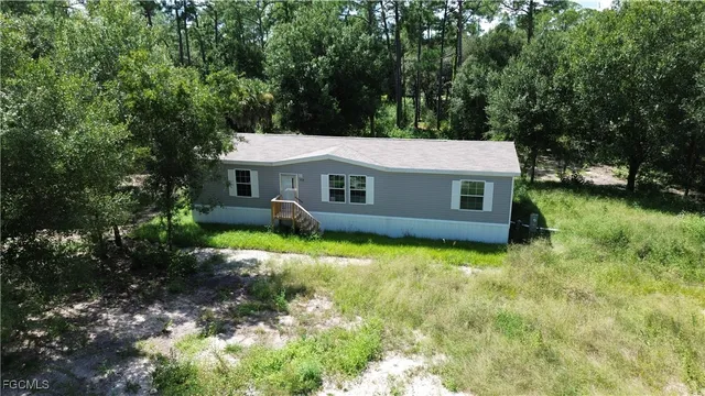 a house with trees in front of it