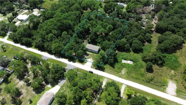 a view of a garden with a building