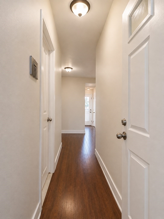 128 Shawmut Street, Unit 2 Chelsea, MA 02150 - Photo 8 of 12 a view of a hallway with wooden floor