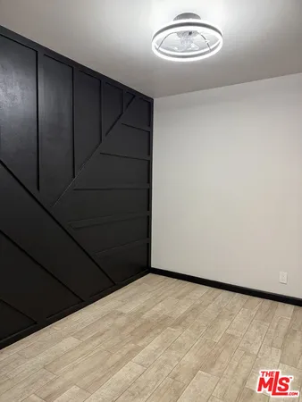 a kitchen with a refrigerator and window