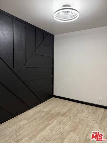 a kitchen with a refrigerator and window