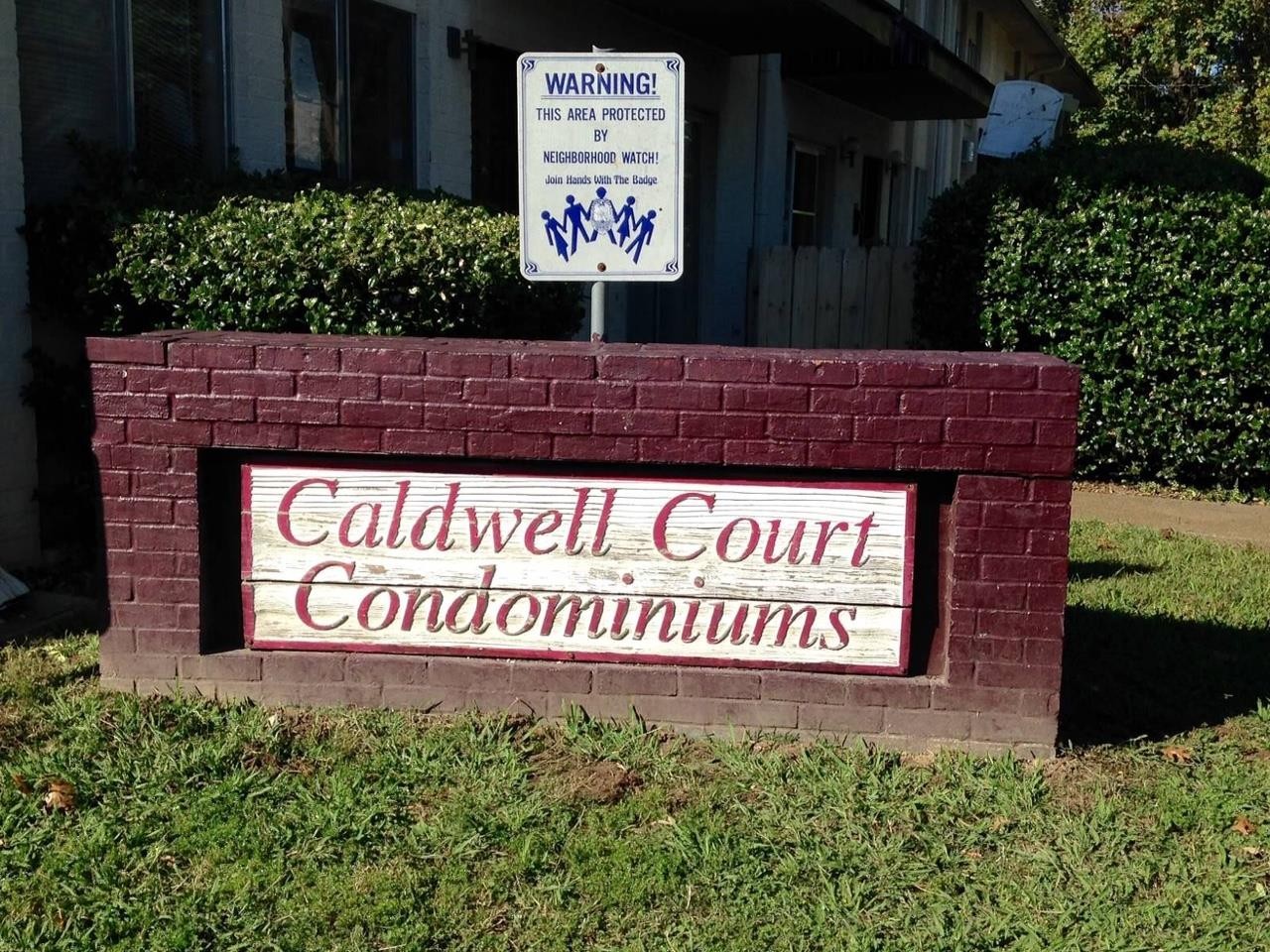 a sign broad in front of a building