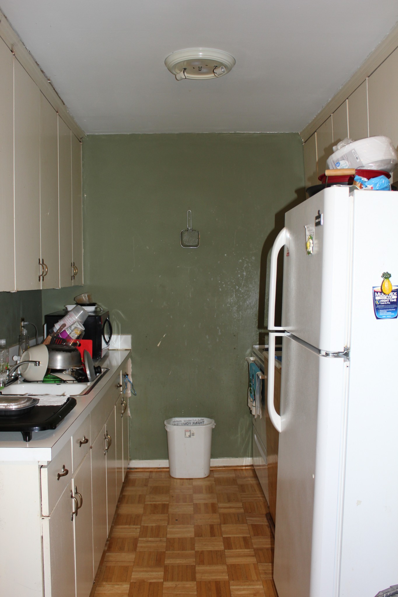 550 Harding Place, Unit E120 Nashville, TN 37211 - Photo 3 of 3 a kitchen with a sink a refrigerator and cabinets