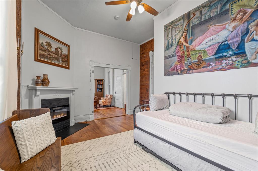 1618 North 6th Street Waco, TX 76707 - Photo 12 of 36 a bed sitting in a bedroom and painting on the wall