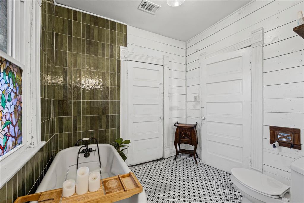 1618 North 6th Street Waco, TX 76707 - Photo 14 of 36 a bathroom with a sink and a shower