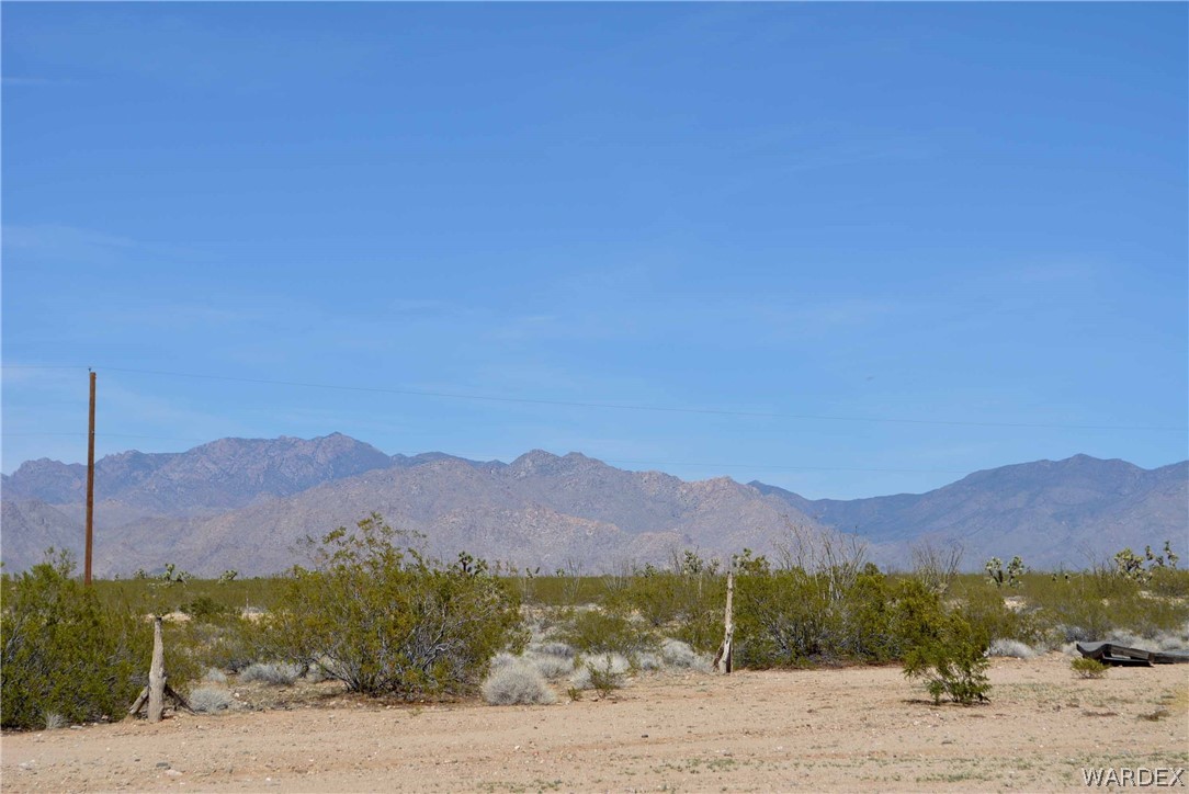 Lot 3398 Santa Fe Ranch Road Yucca, AZ 86438 - Photo 1 of 9 a view of a town with mountains in the background