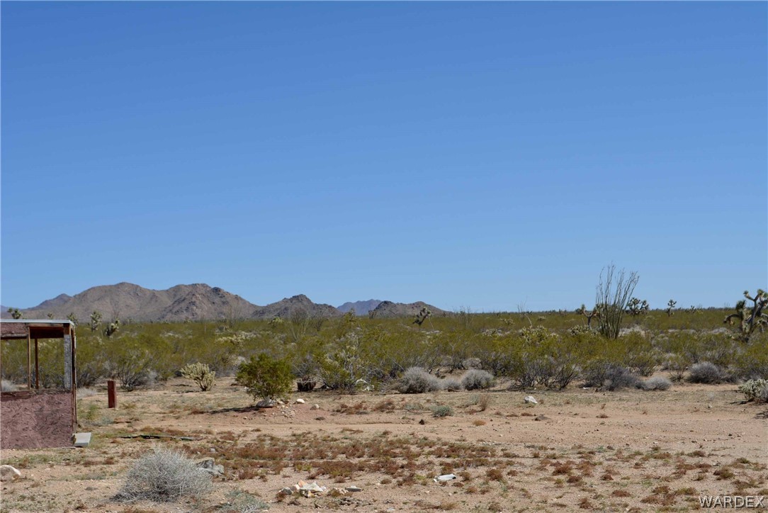 Lot 3398 Santa Fe Ranch Road Yucca, AZ 86438 - Photo 2 of 9 a view of a town with mountains in the background