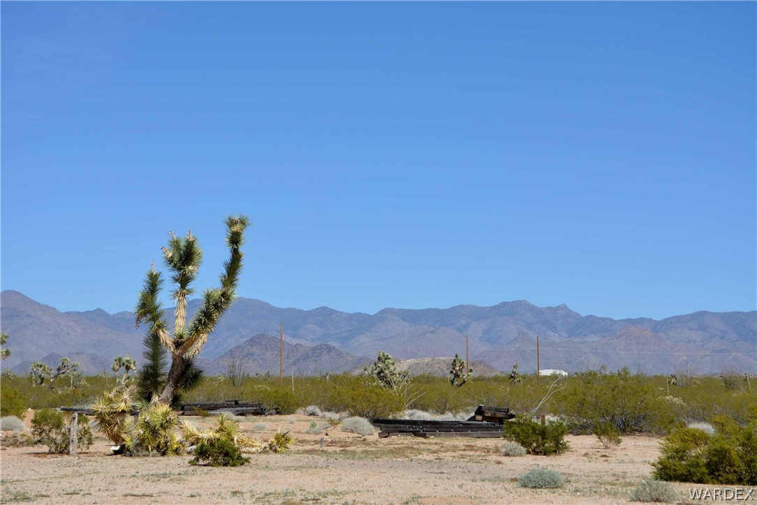 Lot 3398 Santa Fe Ranch Road Yucca, AZ 86438 - Photo 6 of 9 a view of a house with a mountain
