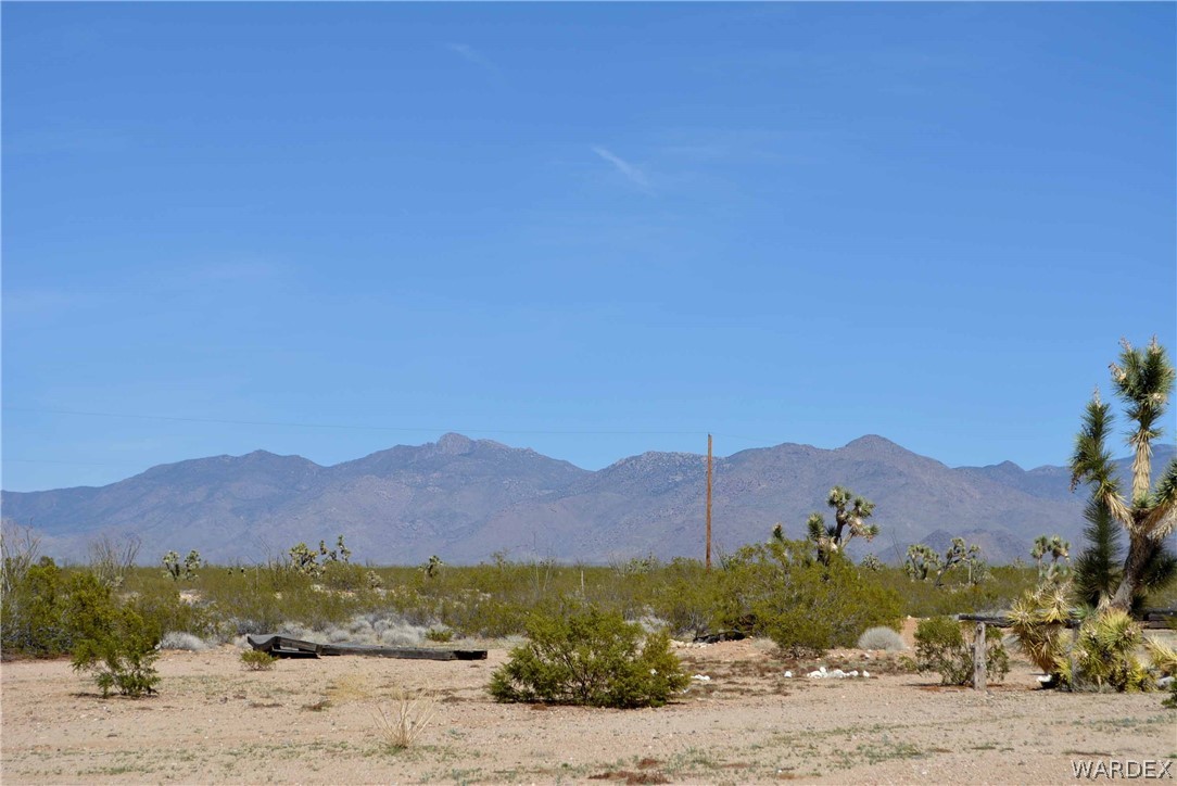 Lot 3398 Santa Fe Ranch Road Yucca, AZ 86438 - Photo 7 of 9 a view of a town with mountains in the background