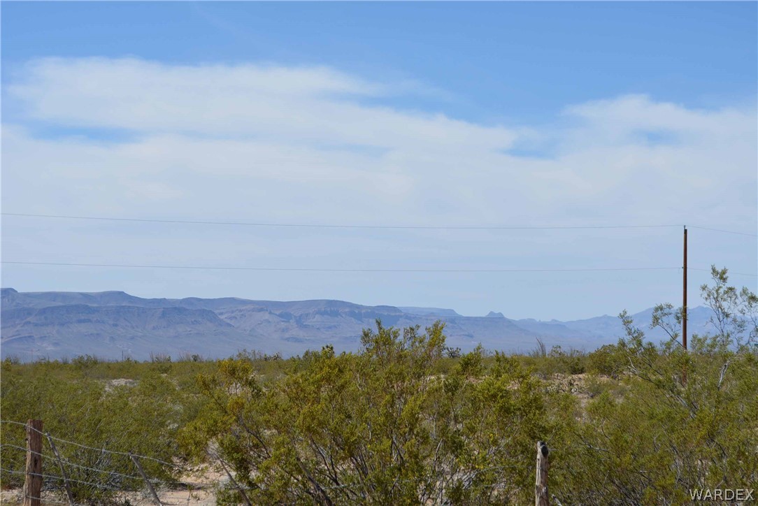 Lot 3398 Santa Fe Ranch Road Yucca, AZ 86438 - Photo 8 of 9 a view of mountain and sunset