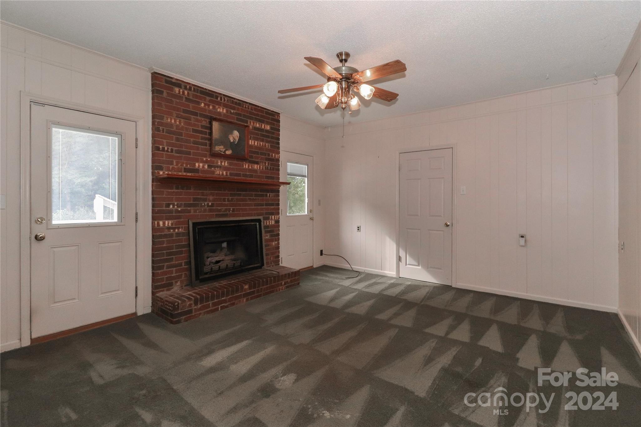168 Mooreland Road Mooresville, NC 28117 - Photo 12 of 31 a view of an empty room with a fireplace
