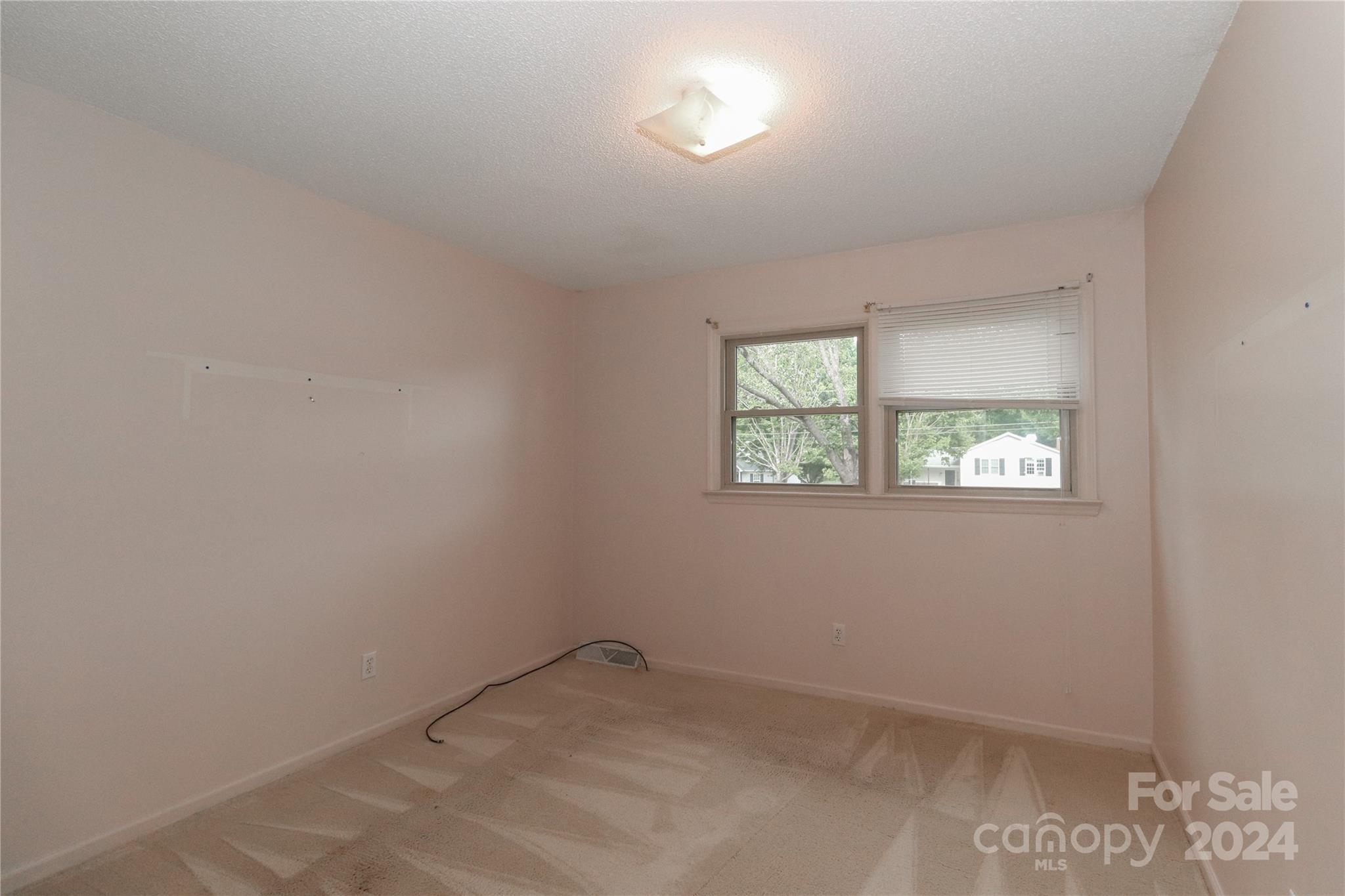 168 Mooreland Road Mooresville, NC 28117 - Photo 15 of 31 an empty room with a window