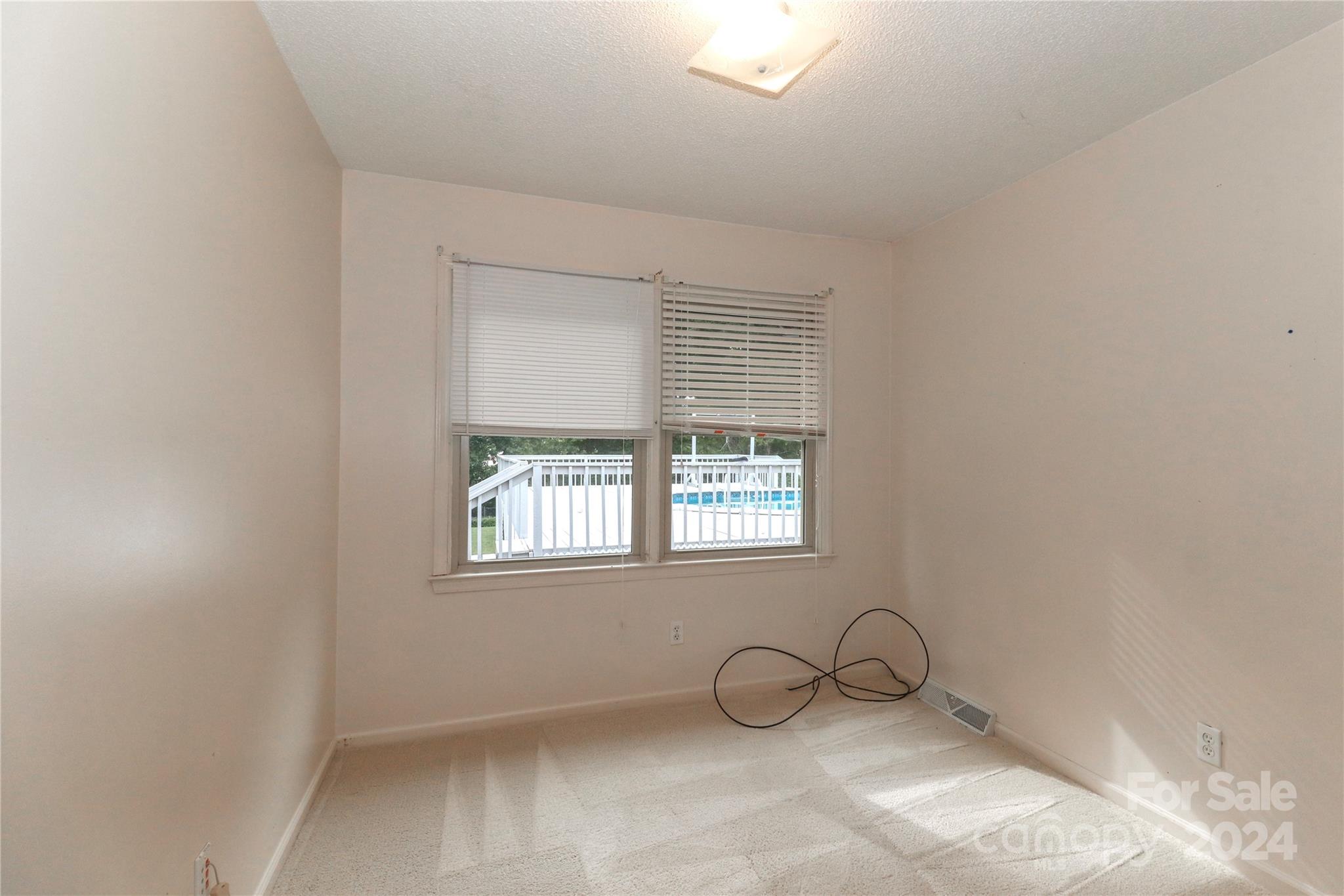 168 Mooreland Road Mooresville, NC 28117 - Photo 16 of 31 a view of a room that has a window and a table in it