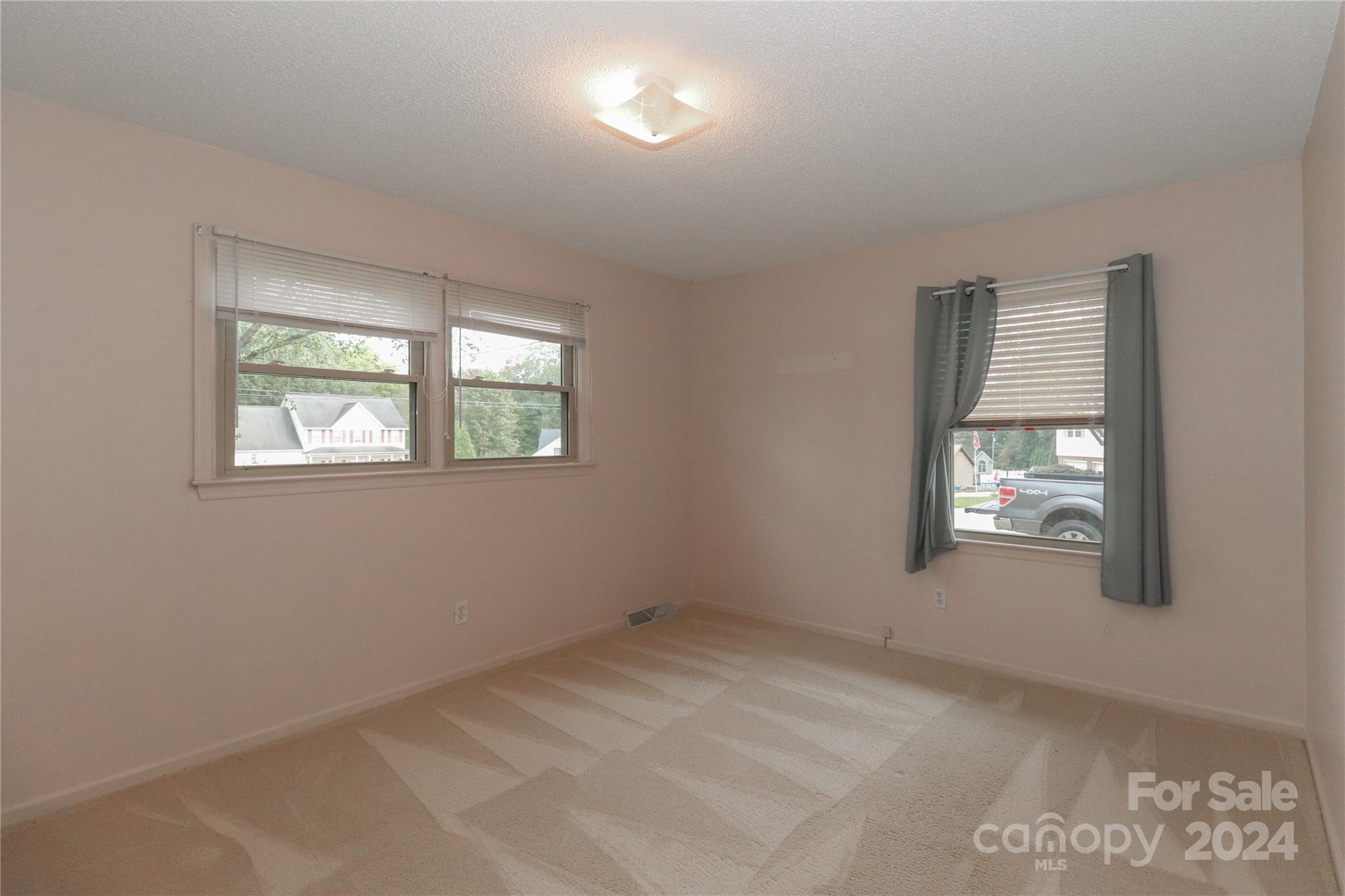 168 Mooreland Road Mooresville, NC 28117 - Photo 17 of 31 an empty room with windows