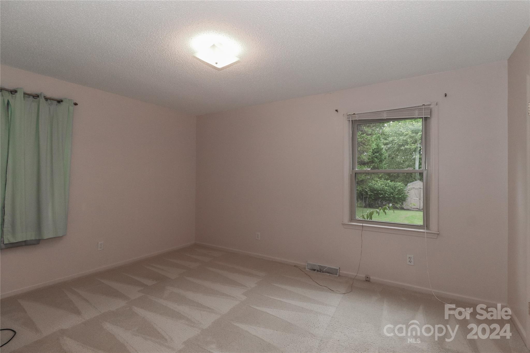 168 Mooreland Road Mooresville, NC 28117 - Photo 19 of 31 an empty room with a window