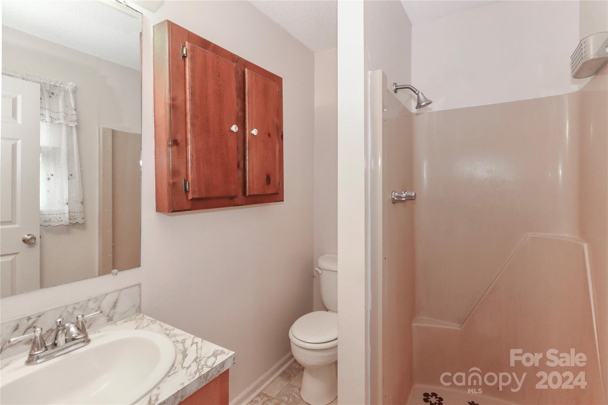 168 Mooreland Road Mooresville, NC 28117 - Photo 20 of 31 a bathroom with a granite countertop sink toilet and shower