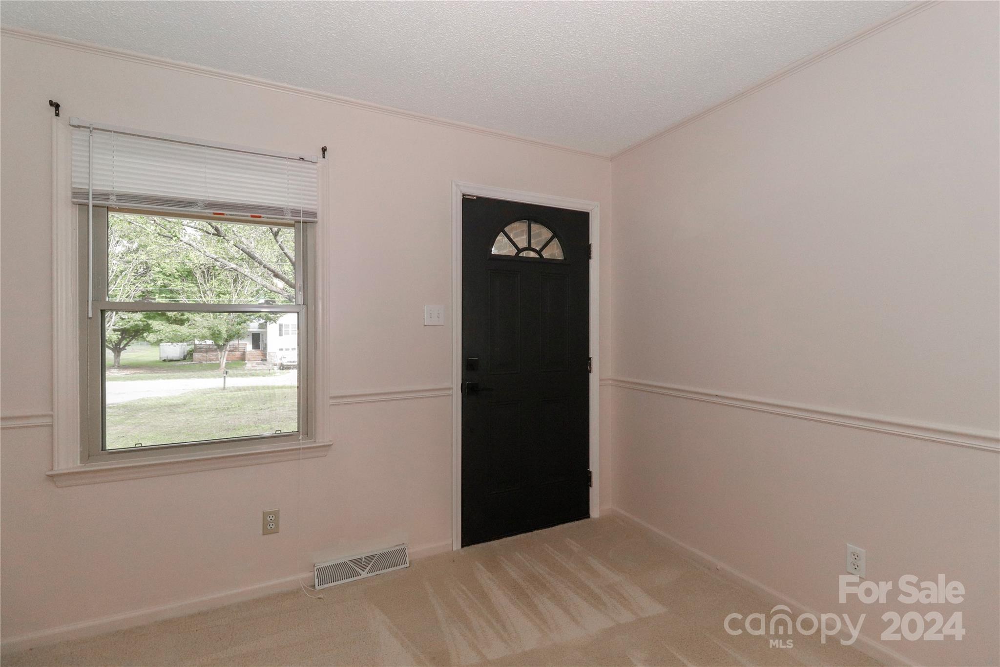 168 Mooreland Road Mooresville, NC 28117 - Photo 2 of 31 a view of an empty room with a window