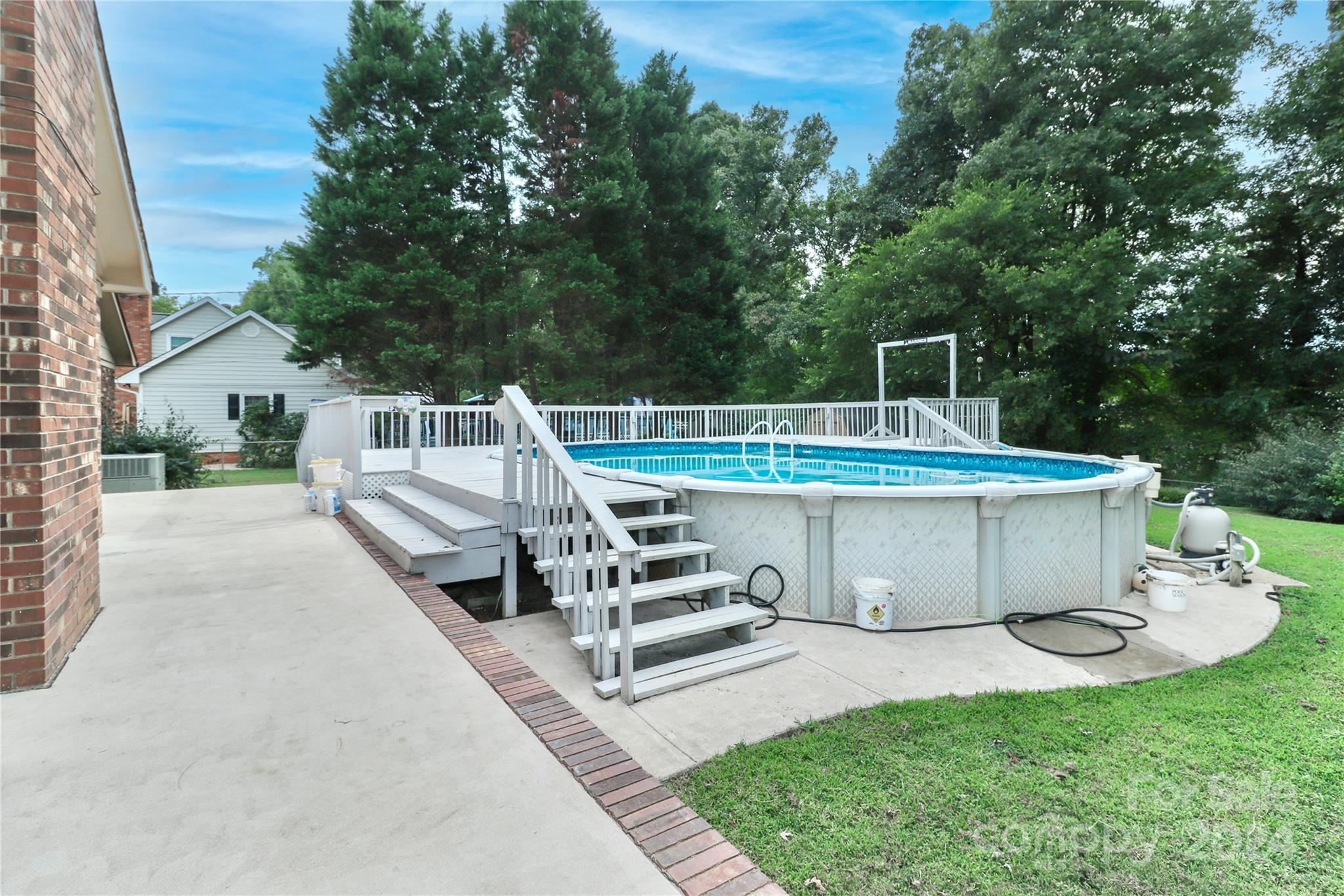 168 Mooreland Road Mooresville, NC 28117 - Photo 22 of 31 a view of a patio with table and chairs a barbeque with wooden fence