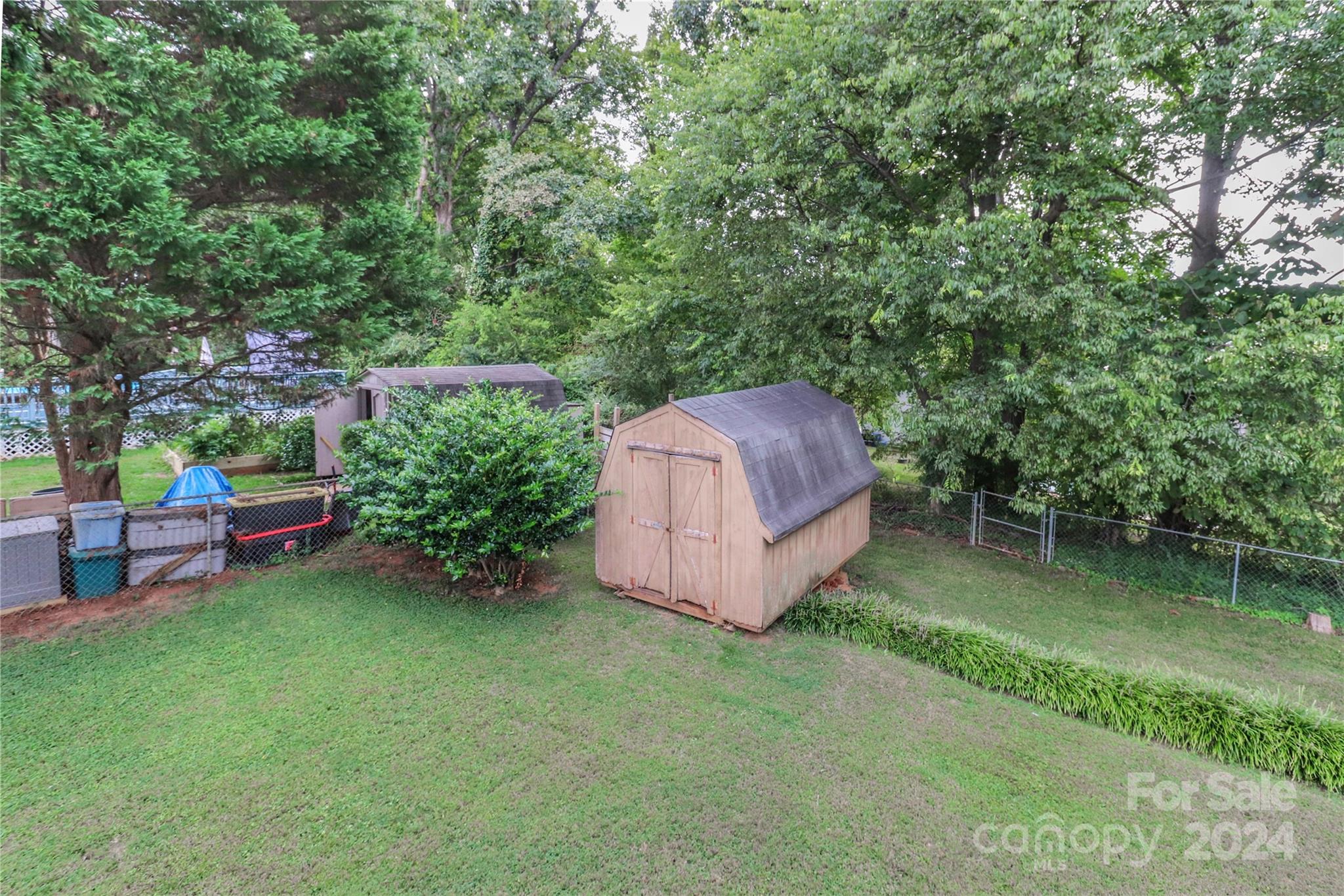 168 Mooreland Road Mooresville, NC 28117 - Photo 30 of 31 a view of a backyard with a garden and entertaining space