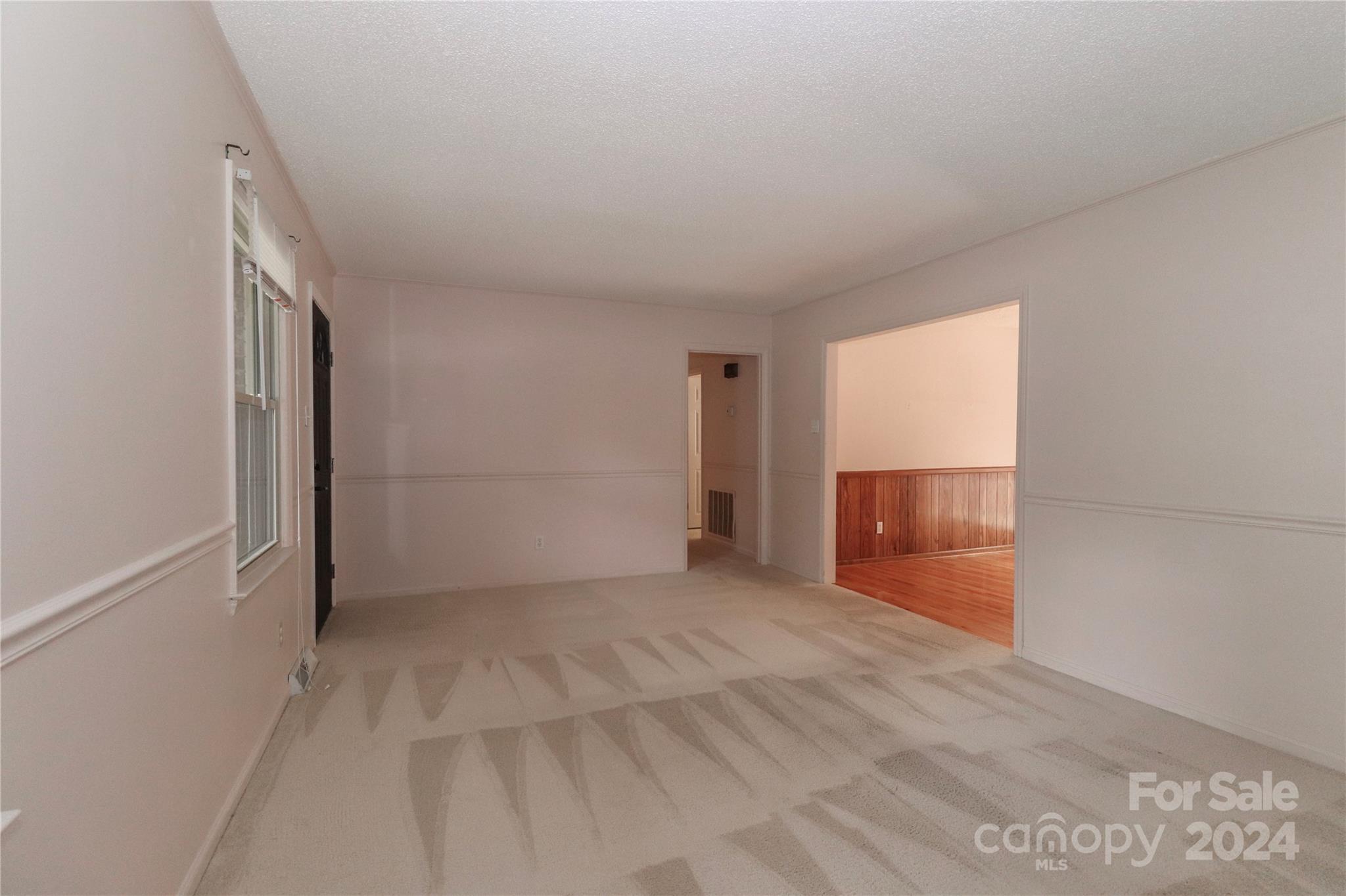 168 Mooreland Road Mooresville, NC 28117 - Photo 5 of 31 a view of an empty room with a window