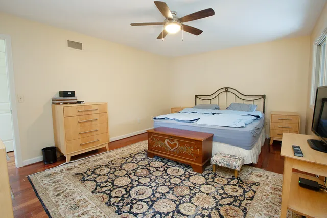 a room with furniture and wooden floor