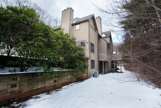 a front view of a house with a lake view