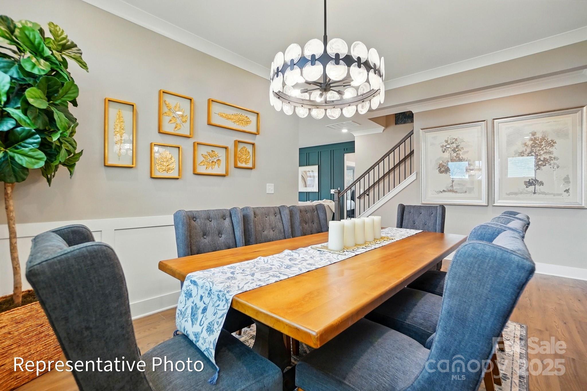 2019 Mantle Rdg Drive Indian Trail, NC 28079 - Photo 19 of 27 a view of a dining room with furniture and a chandelier