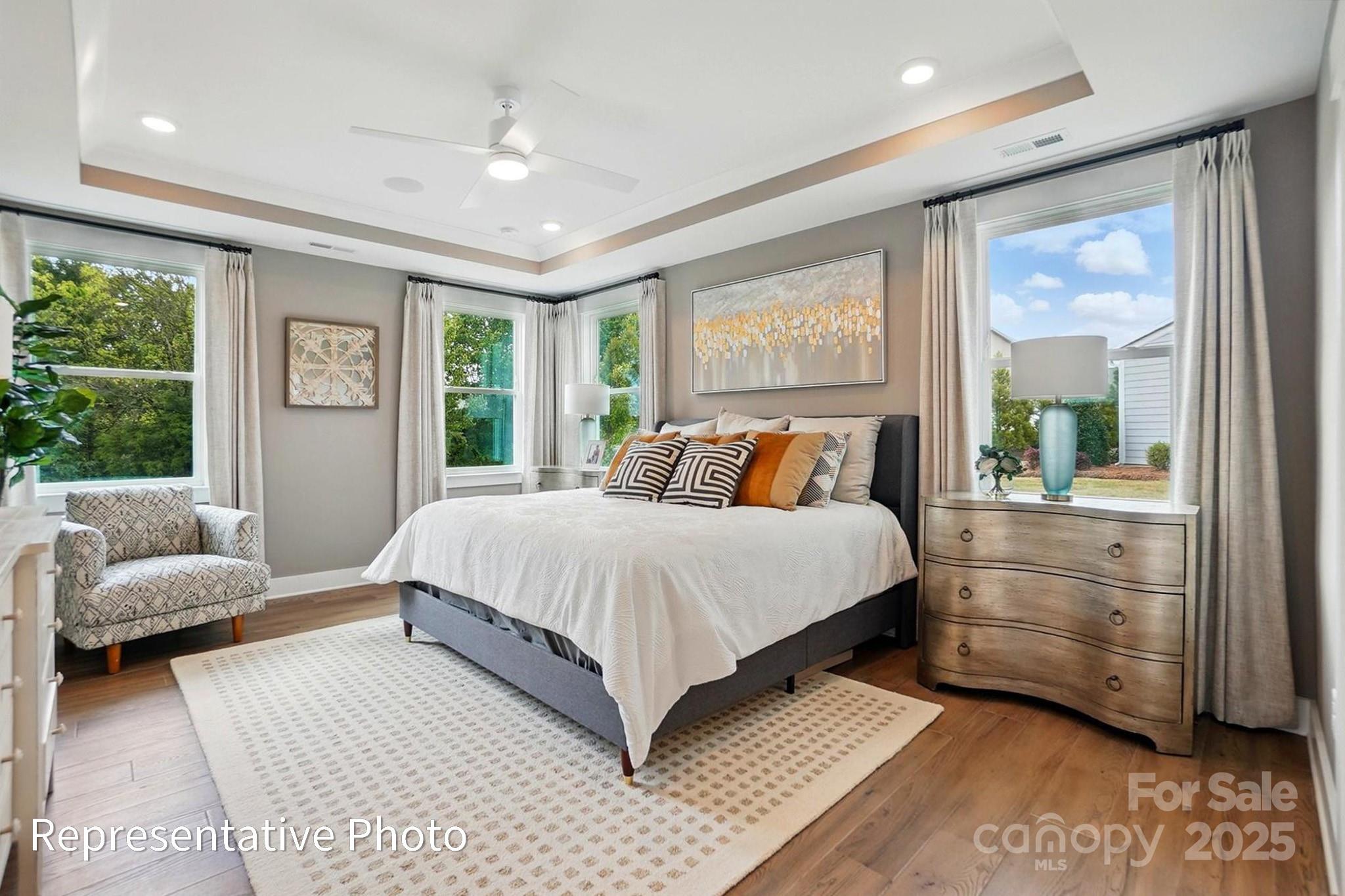 2019 Mantle Rdg Drive Indian Trail, NC 28079 - Photo 21 of 27 a bedroom with a large bed and a couch