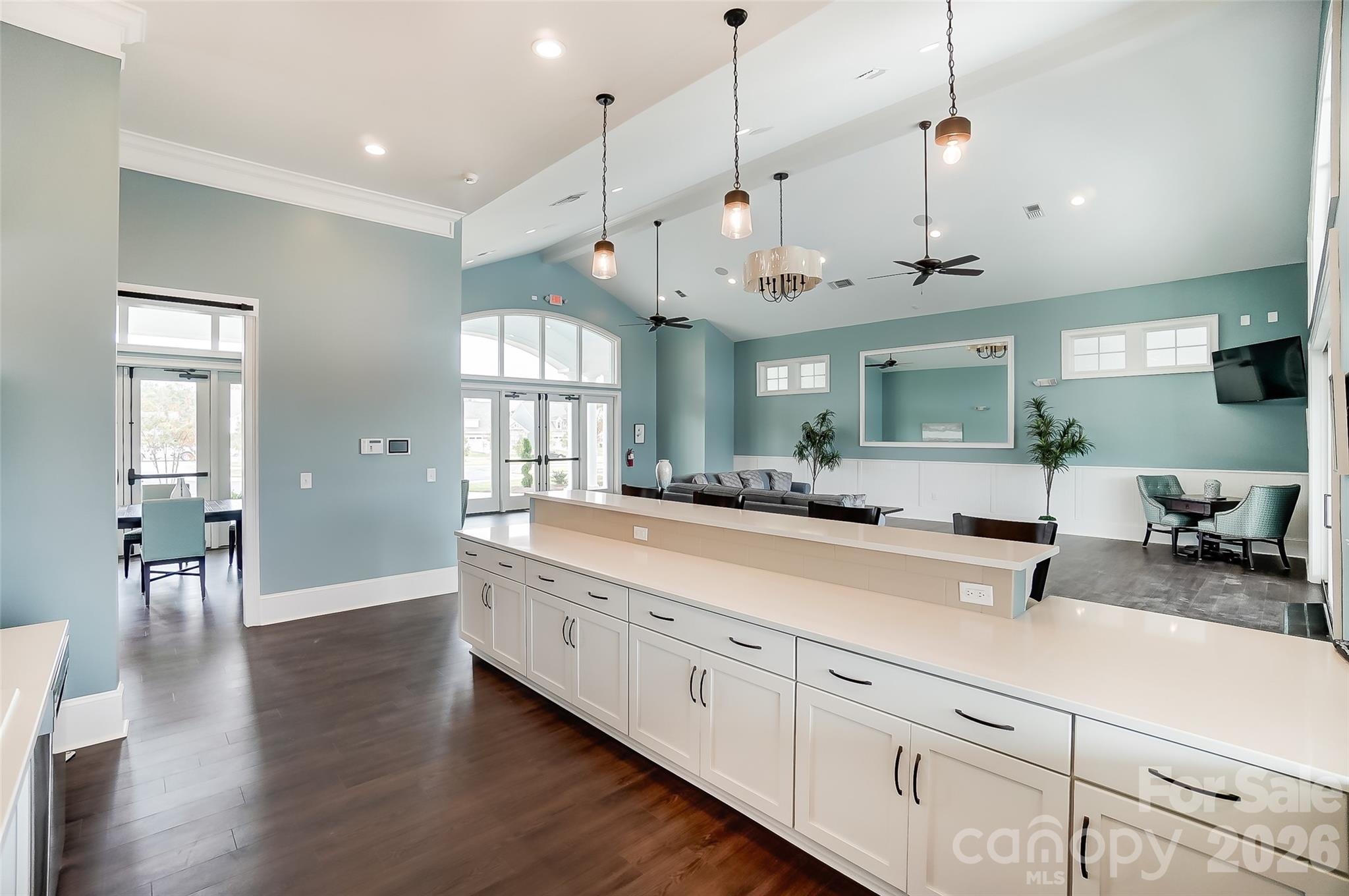 2019 Mantle Rdg Drive Indian Trail, NC 28079 - Photo 25 of 41 a large room with stainless steel appliances kitchen island granite countertop a dishwasher a stove a dining table and chairs with wooden floor