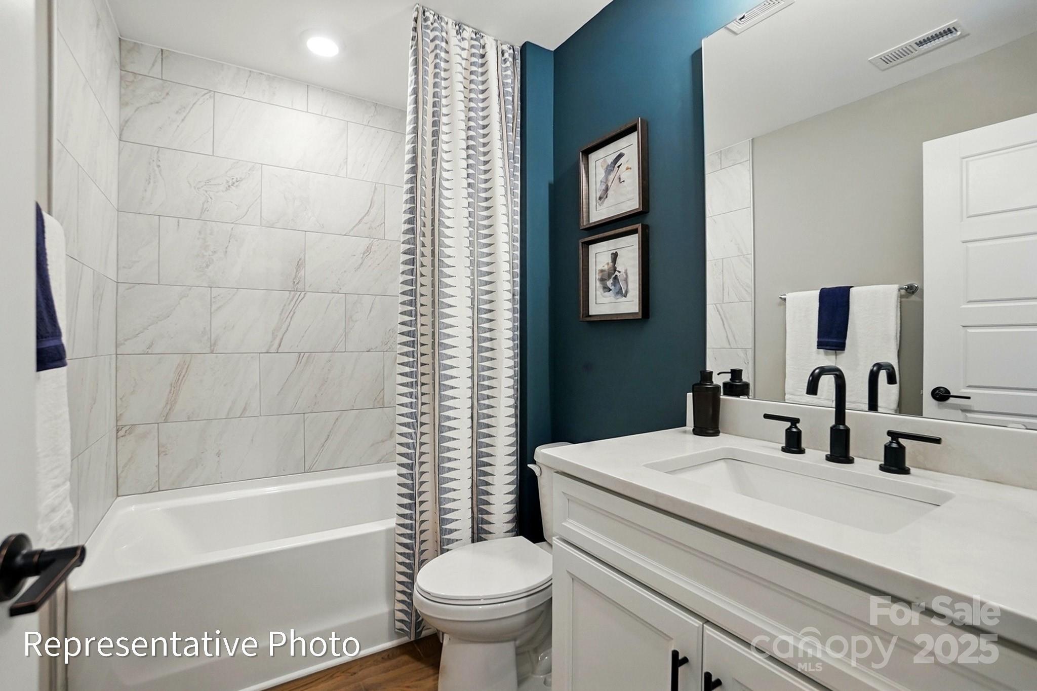 2019 Mantle Rdg Drive Indian Trail, NC 28079 - Photo 26 of 27 a bathroom with a sink toilet and shower