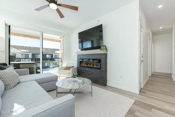 a living room with furniture and a fireplace