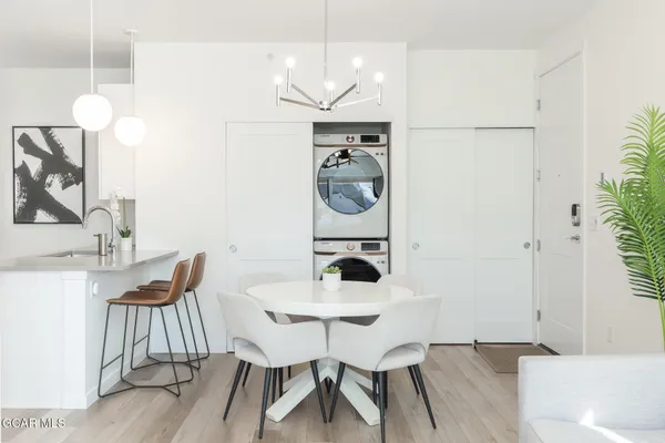 a kitchen with refrigerator and sink