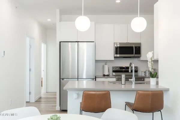 a bedroom with a bed and a lamp on table