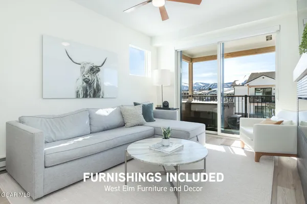 a bedroom with a bed and a lamp