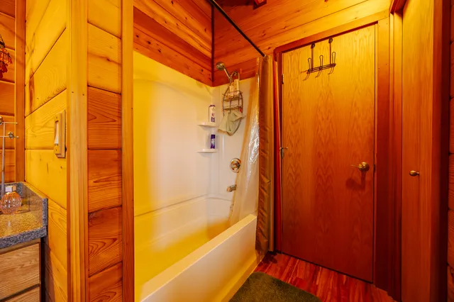 a view of a swimming pool with potted plants