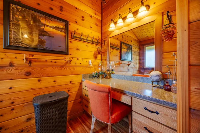 a bedroom with a bed and a large window with the outer view