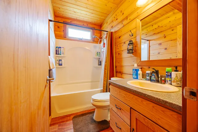 a view of a house with pool and a yard