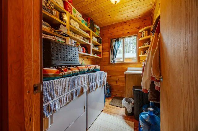 an aerial view of a house with swimming pool garden view and deck