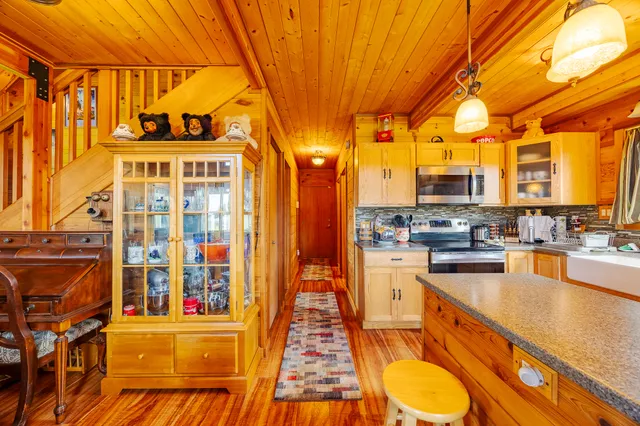 a kitchen with stainless steel appliances granite countertop a stove and cabinets